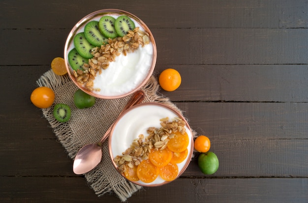 Natural healthy yogurt with muesli and fruit.