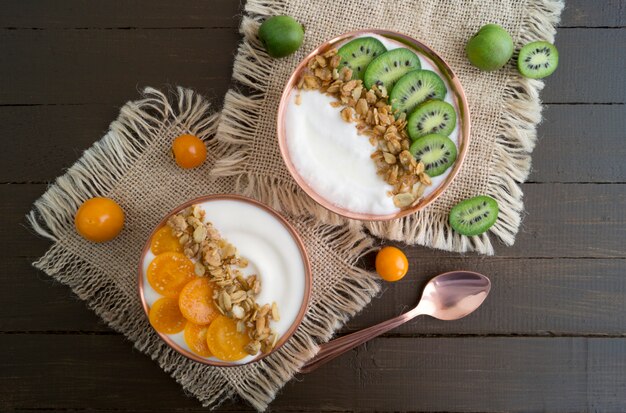 Natural healthy yogurt with muesli and fruit.