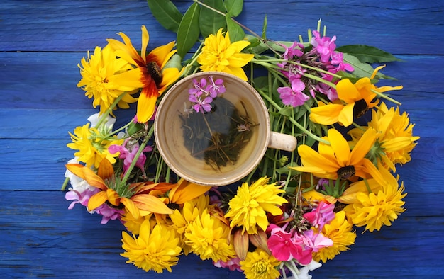 Natural herbal tea with medical herbs in ceramic cup