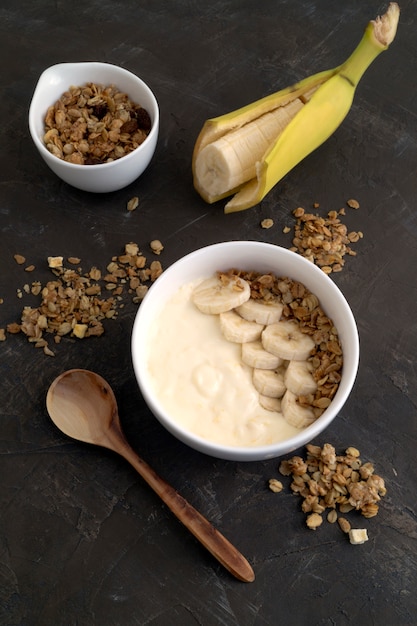 Natural homemade yogurt with muesli and banana.