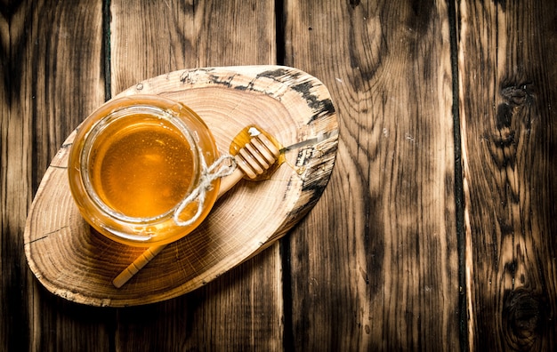 Natural honey in glass jar