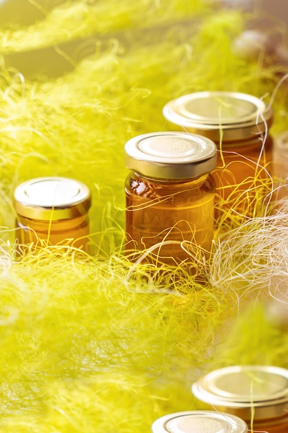 Natural honey in various jars on a wooden shelf souvenir village market