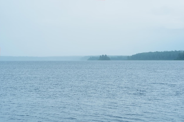 natural landscape vast shallow lake on a rainyday the downpour hides the distant shore