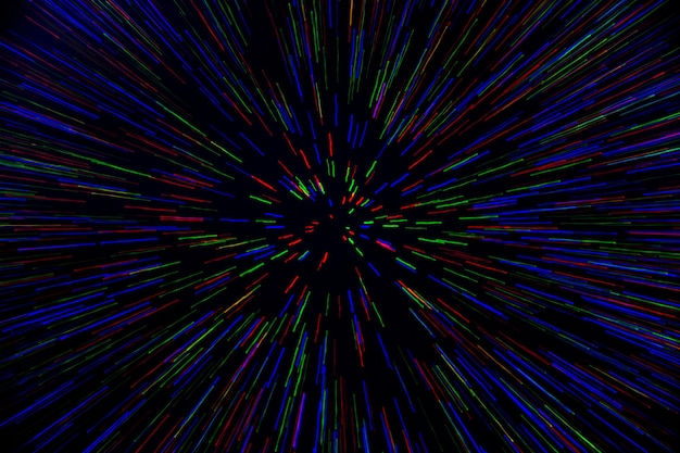 Natural lens zoom explosion radial blurred red green blue dots on black background