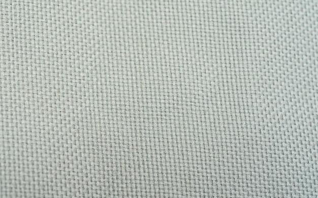 Natural linen texture as background. Close-up fabric textile texture to background in a high resolution macro view. artistic background, white linen canvas, close up