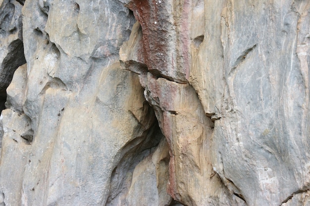 Natural marble stone cliff precipice texture background.