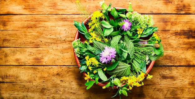 Natural medicine,fresh herbs on wooden table