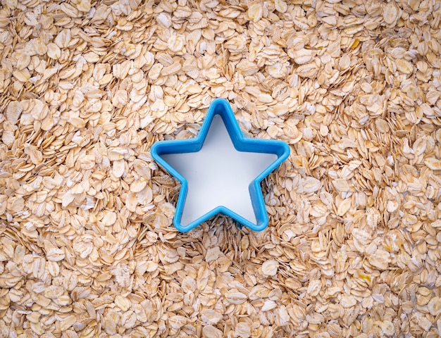Natural oatmeal flakes and blue star mold