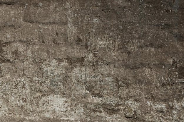 茶色の漆喰石壁の自然な古い質感