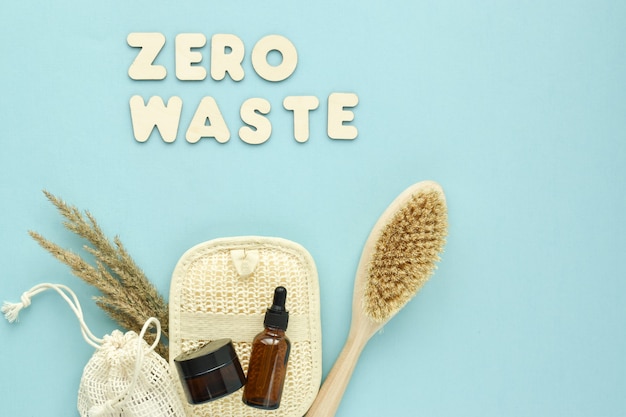 natural organic accessories for spa treatments on a light blue background. zero waste. body care. eco-cosmetics. flat layout, top view, a place to copy.
