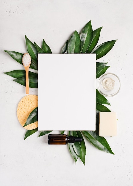 Natural organic cosmetic and bath brush flat lay mock up with leaves on white background