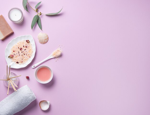 Photo natural organic cosmetics with pink salt on a pink background