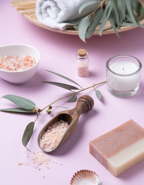 Natural organic cosmetics with pink salt on a pink background