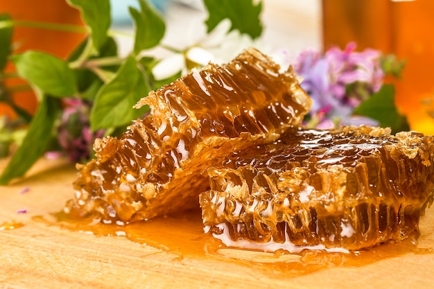 Natural organic honey  on a wooden table closeup