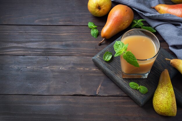 Natural pear juice in a glass cup