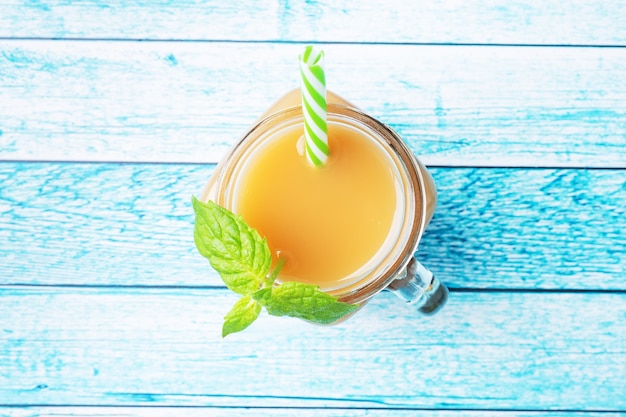 Natural pear juice in a glass cup