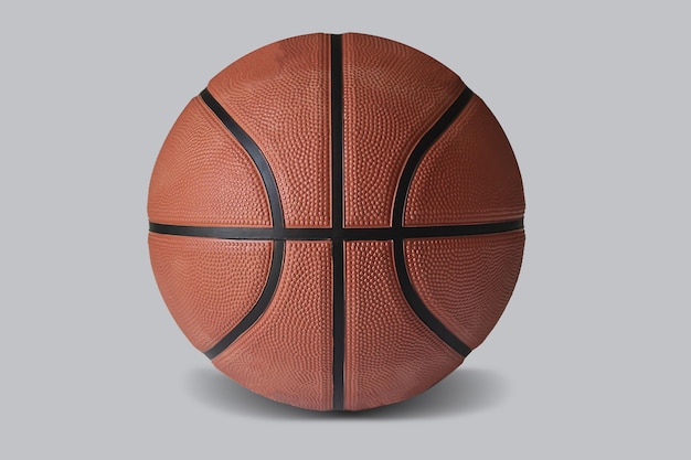 Natural photo of a basketball. Brown-orange basketball on a light background.