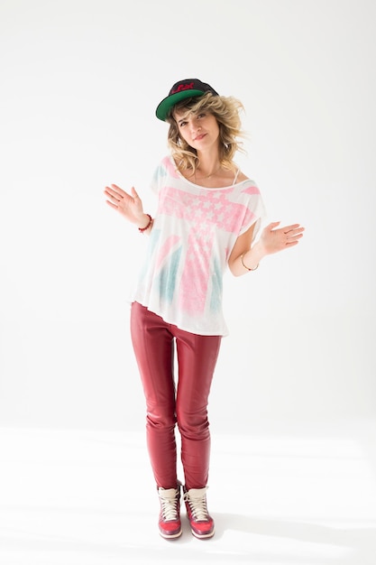 Natural portrait of girl with hat on neutral background