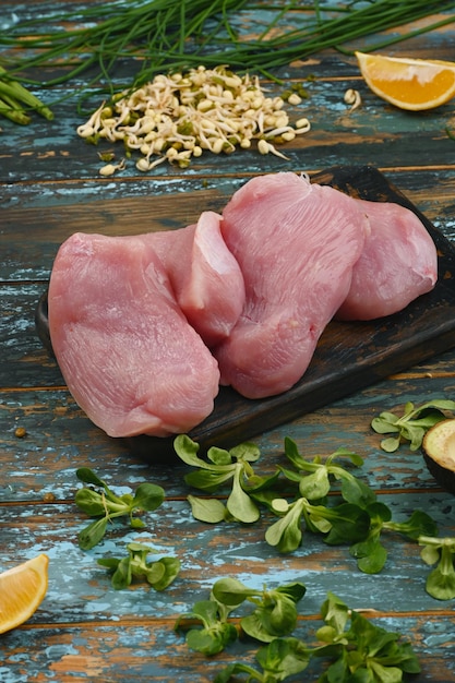 Natural raw ingredients for healthy food on rough dyed wooden background