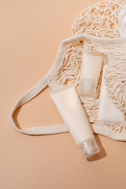 Natural skincare beauty product in mesh bag on beige backdrop