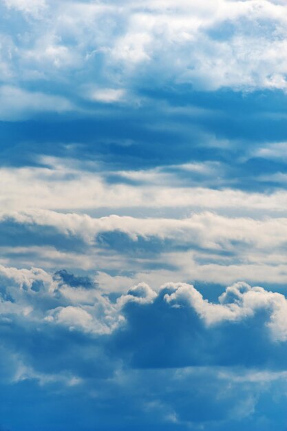 Natural sky composition. sunny vast blue sky abstract\
background. beautiful cloudscape, view over white fluffy clouds.\
freedom concept, on the heaven. element of design.