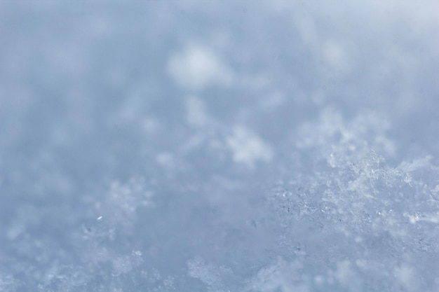 Natural snowflakes on snow photo of real snowflakes Winter snow background Snowflake closeup Macro photo Copy space