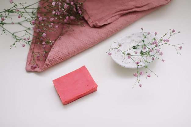 Natural soap bar with ceramic soap dish and flowers spa organic concept