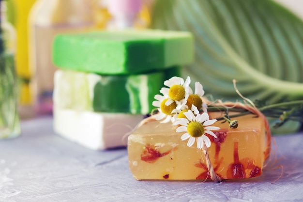 Natural soap skin care products oils tinctures and chamomile flowers