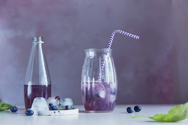 Natural soft cocktail with blueberries seeds basil extract leaves berries ice Refreshing Asian drink