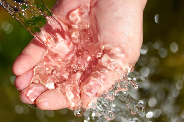 Natural spring water in the hands