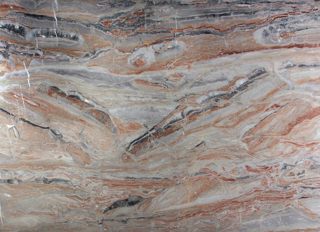 写真 アラベスカトゴールドと呼ばれる、白、灰色、赤の染みが付いた天然石の大理石のピンク。