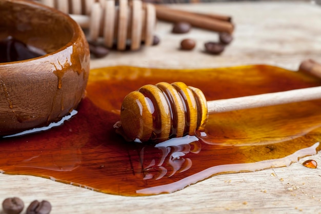 Natural sweet honey spreads on the board during cooking