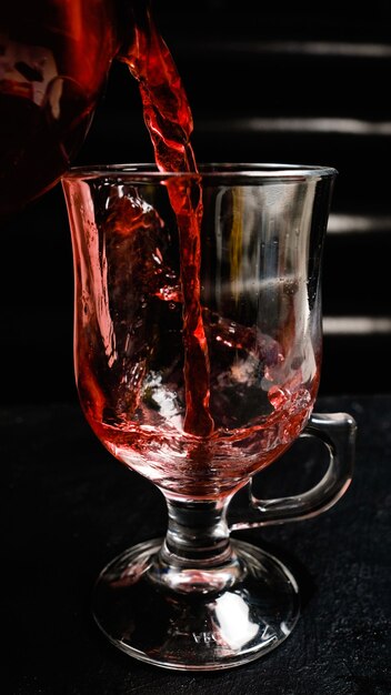 Natural tasty mulled wine poured in a glass. Tasty aromatic healthy hot beverage to keep warm in winter