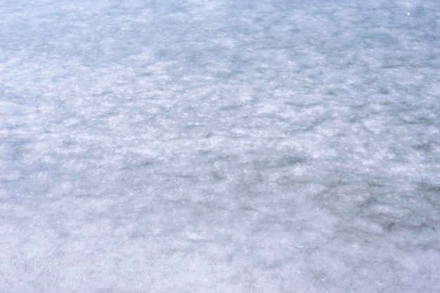 Natural texture of ice frozen lake as a background