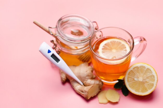 Natural treatment for colds and flu. Ginger lemon honey garlic and rose hip tea against influenza. Hot tea for colds. Home Pharmacy. Proven treatment of diseases. Folk medicine.