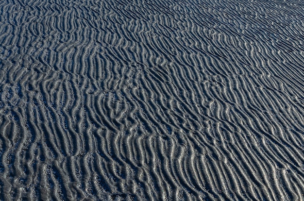 Natural white salt crystal texture on the sand