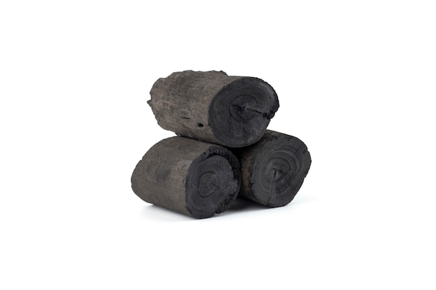 Natural wood charcoal isolated on white background. Pile of coal isolated on white background.