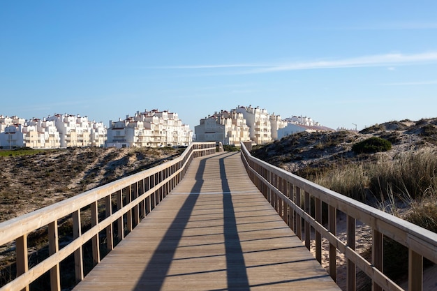 Natural wooden walkway in Peniche Portugal in day light