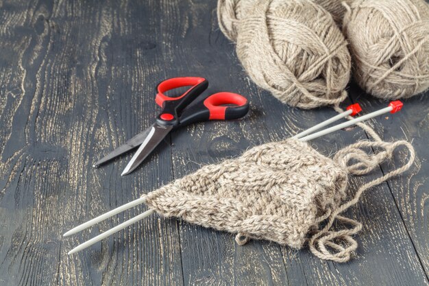 Natural wool for knitting on table