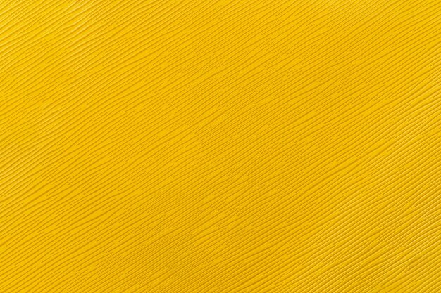 Natural yellow leather texture with oblique stripes top view