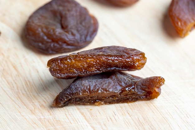 Naturally dried ripe apricots fresh and very sweet dried apricots on a wooden board