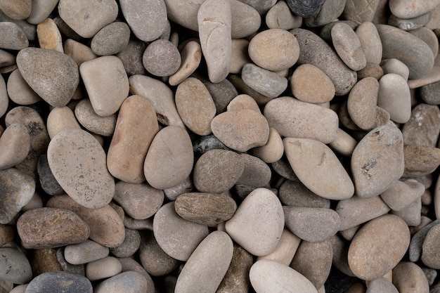 naturally polished white rock pebbles background texture of natural stones