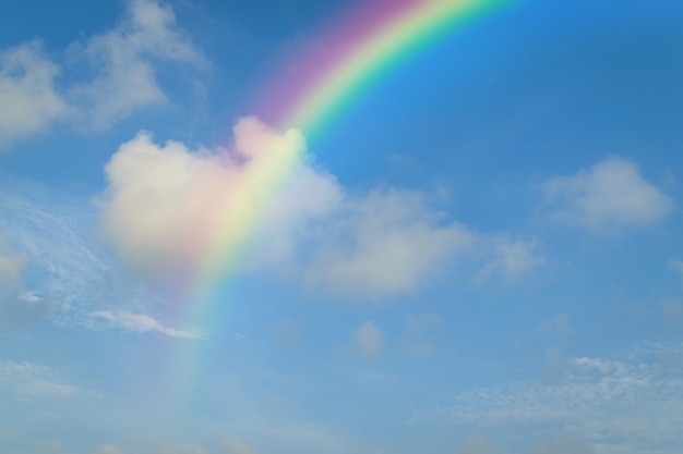 Nature cloudscape with blue sky and white cloud with rainbow