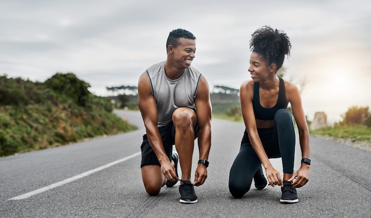 Photo nature fitness and couple tie shoelace in road with running exercise for race or marathon training sports outdoor and people of track and field athletes preparing for cardio workout in mountain