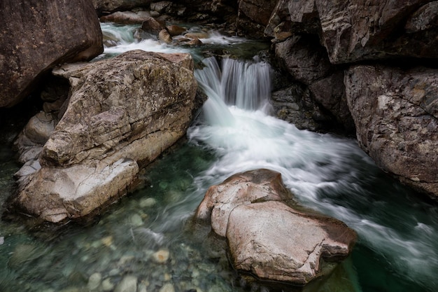 Nature landscape of a waterfall and river flowing in a canyon