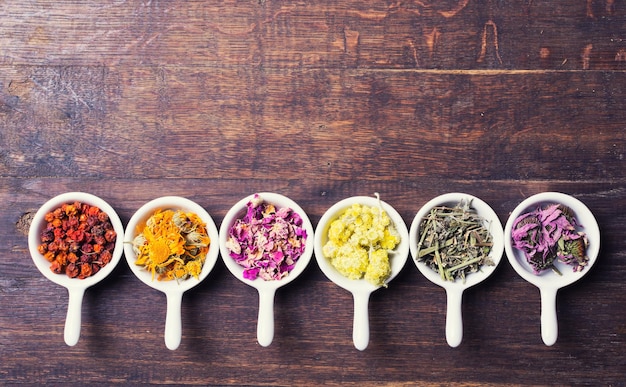 Nature medicine Herbs on wooden background