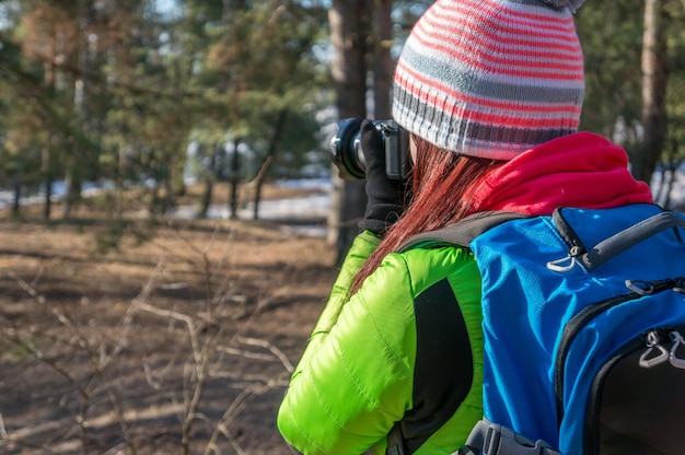 Nature photographer taking photos in forest