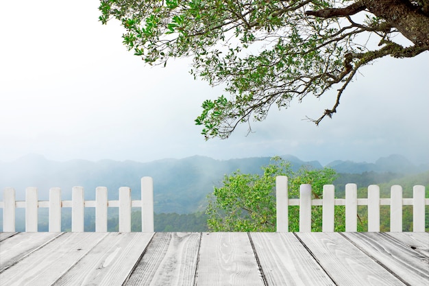 Nature spring background with white fence and wooden planks