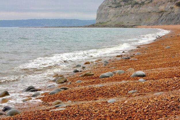 Photo nature travel beach sand landscape seascape ocean waves rocks seashore beach landscape