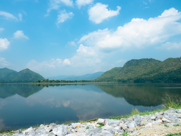 Nature view mountain and lake with blue sky and white cloudy landscape and valley shadow